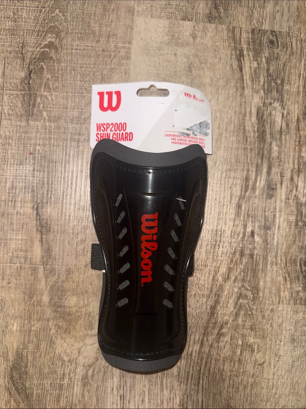 Shield-like sports shin guard